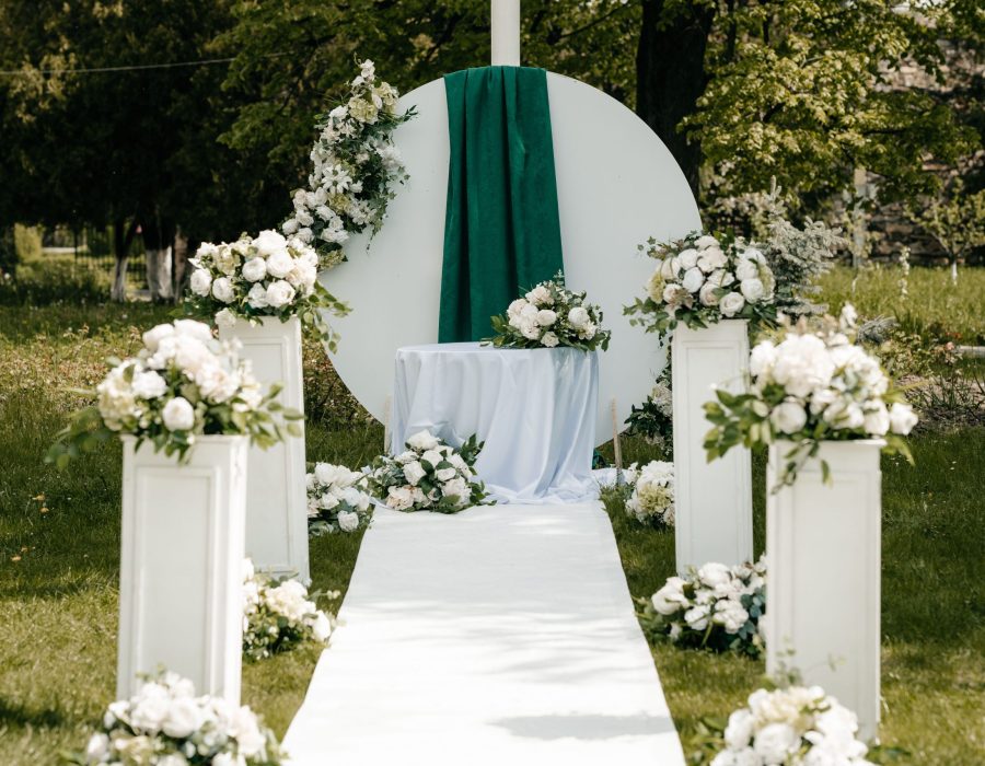 A scenic view of open-air wedding decorations in a green park